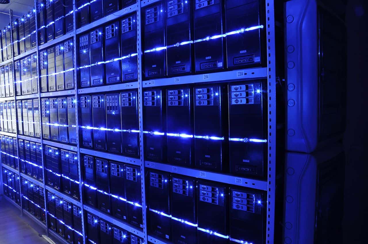 Rows of servers in a data center, representing the compute behind the Claude Sonnet 5 and GPT-5.4 AI models