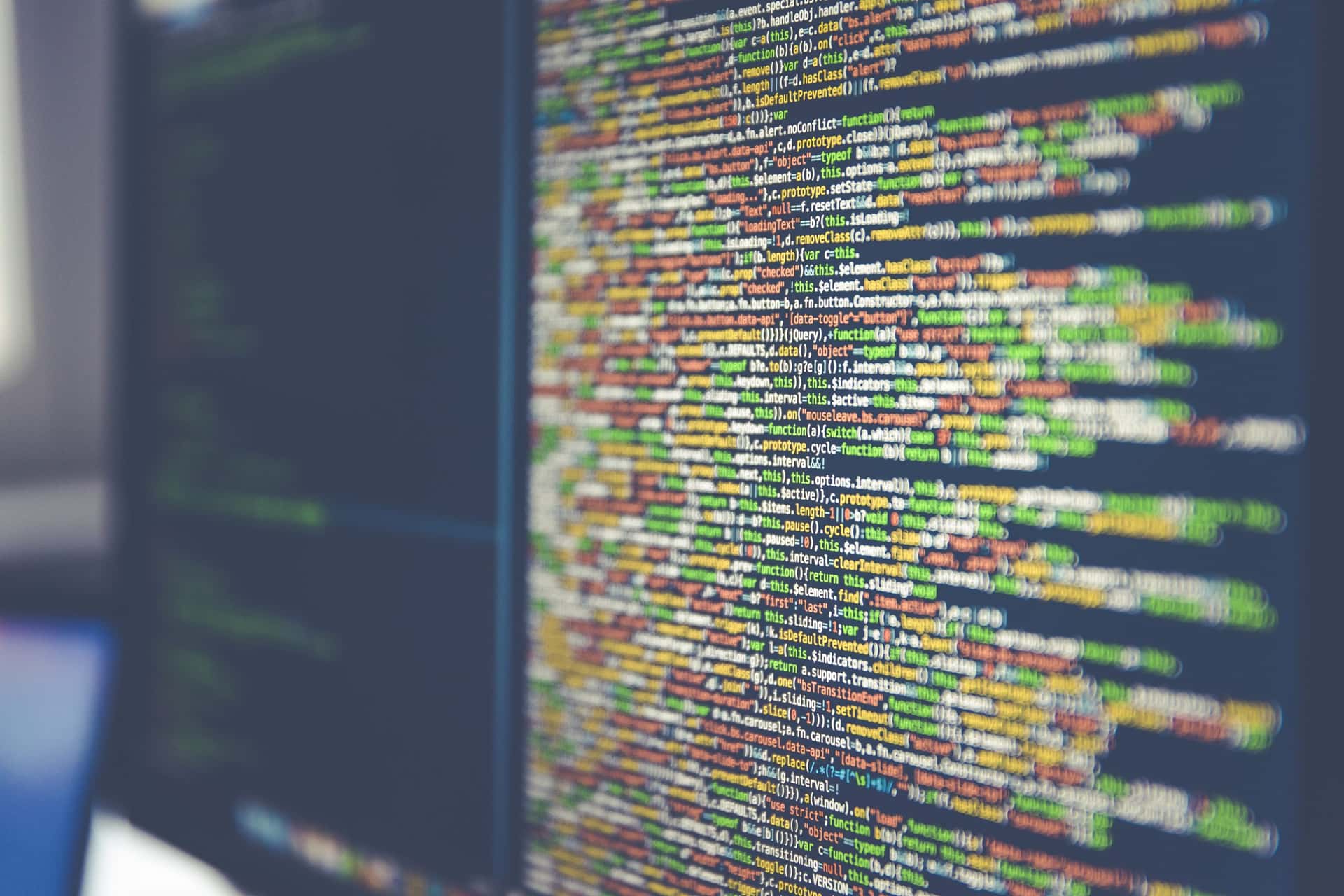 Computer monitor displaying code, used for article about Claude code leak trend