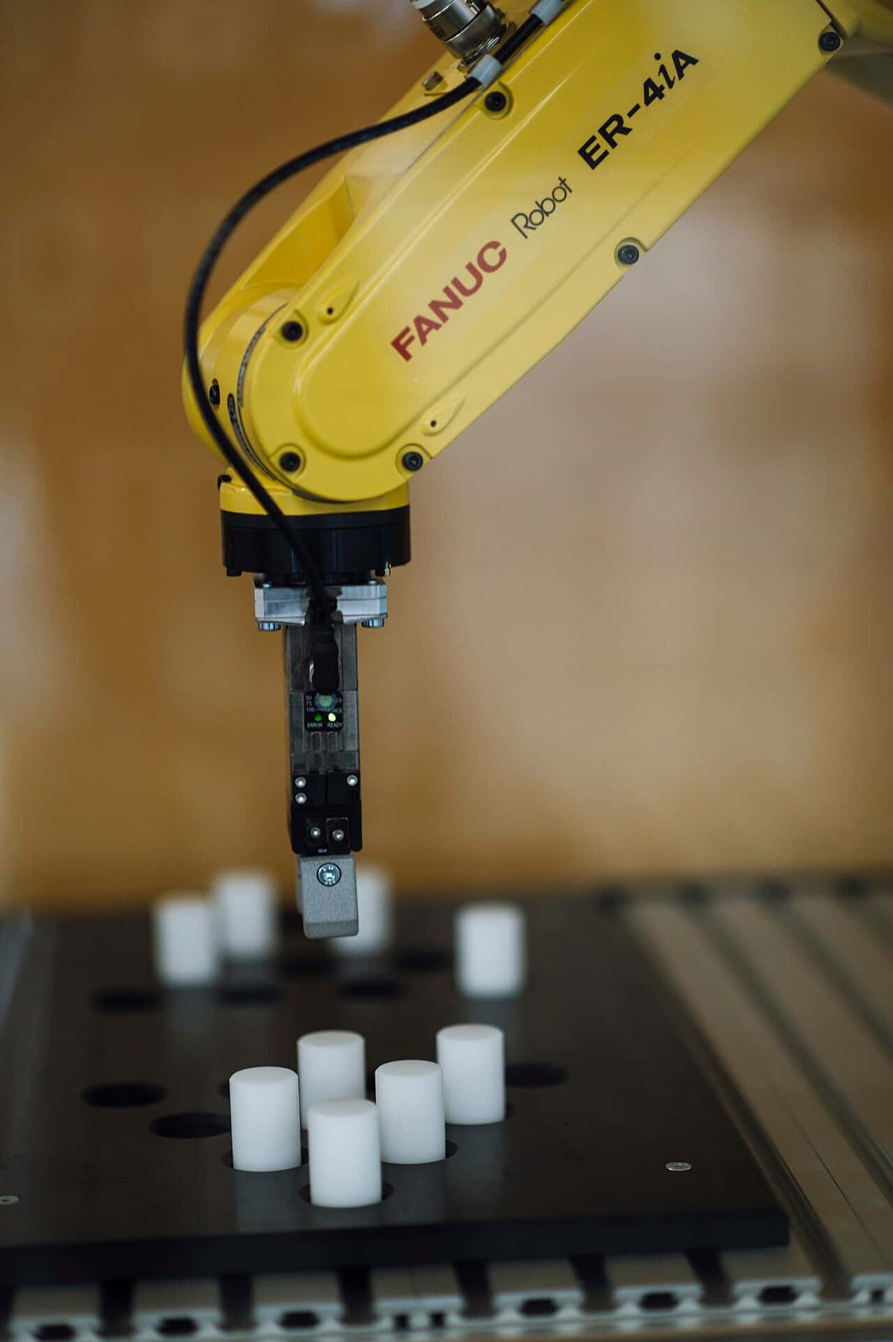 Industrial robot arm on a factory line - AI-driven automation in manufacturing