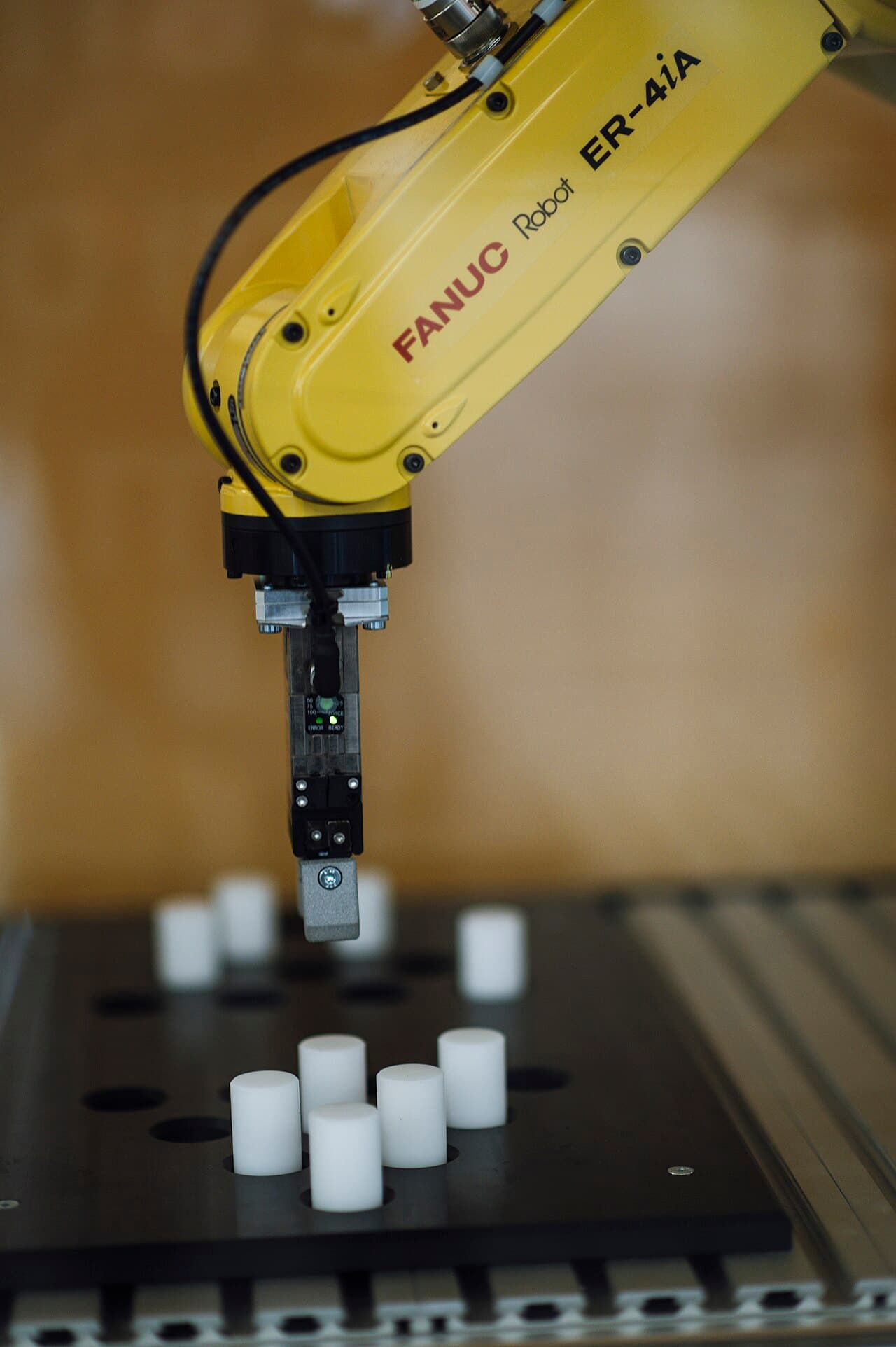 Industrial robot arm on a factory line - AI-driven automation in manufacturing