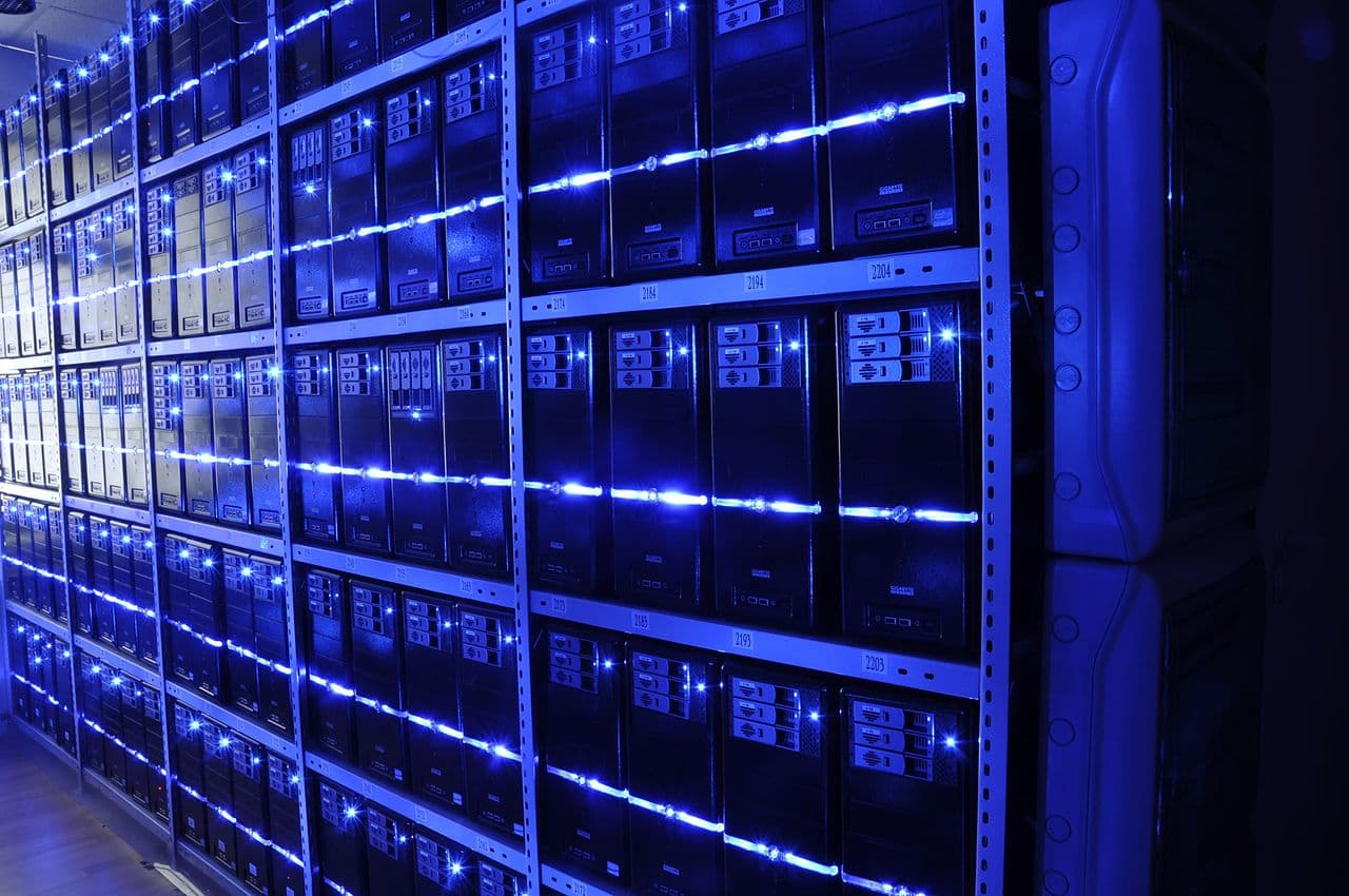 Rows of servers in a data center, representing the compute behind the Claude Sonnet 5 and GPT-5.4 AI models